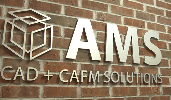 AMS logo on brick wall
